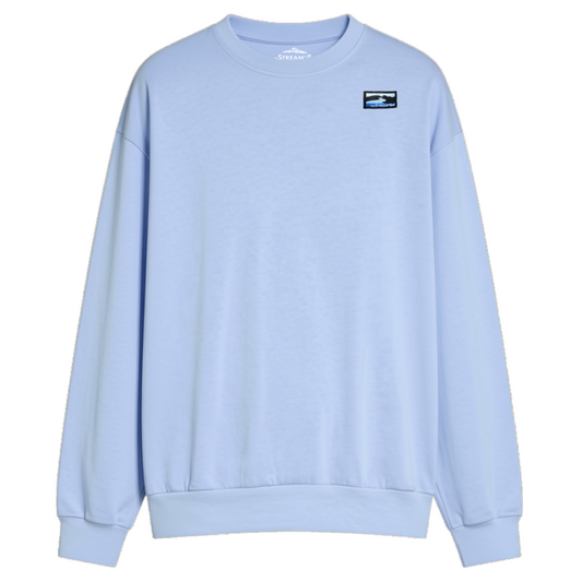 A light blue crewneck sweatshirt with a small rectangular graphic patch on the left chest, displayed on a clean white background.